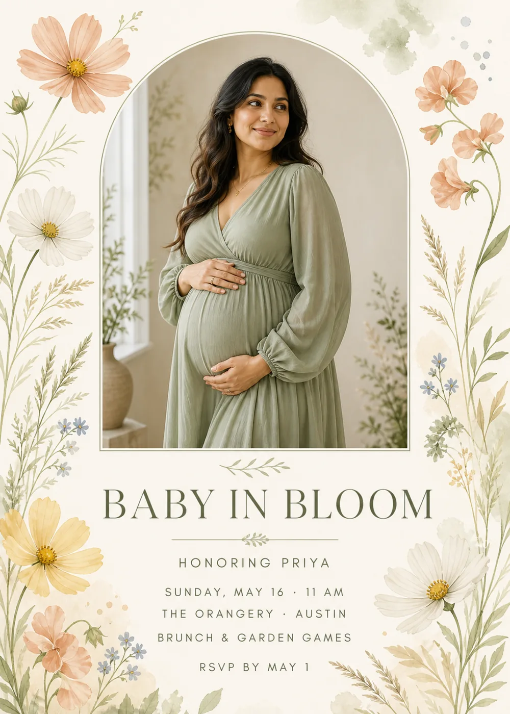 Baby in Bloom shower invitation with a sample portrait of a parent-to-be in a long-sleeved sage dress, hands resting on the bump, inside a tall arch outlined in a fine sage line on ivory paper, with watercolor peach, white and butter-yellow cosmos, small blue flowers and wispy grasses down both sides and “Baby in Bloom” in olive serif capitals above the details